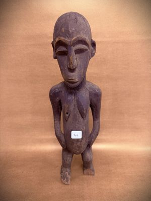 statue of a man standing with his hands in his pockets