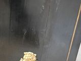 a black and gold cabinet with a lion head on the front