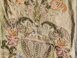 an old embroidered vest with a floral design on it