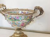 a large ornate bowl sitting on top of a table