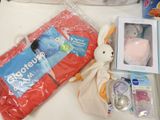 a bag of baby products and a stuffed animal on a table