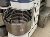 an image of a commercial mixer in a kitchen