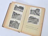 an open book with pictures of trains on the pages