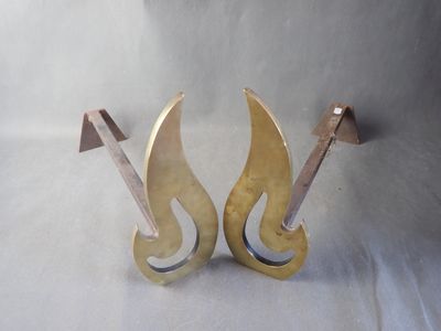 a pair of gold metal scissors on a white background