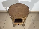a small wooden table with a drawer underneath it