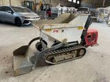a small machine that is sitting in a garage