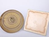 a plate and a bowl sitting on a white surface
