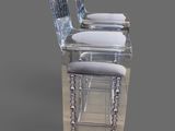 three chairs that are sitting next to each other