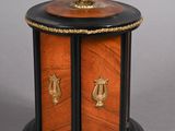 an image of a small wooden table with a clock on top of it