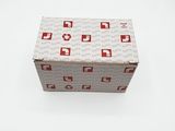 an open box with a red and white pattern on it