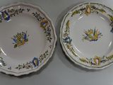 two plates that are sitting side by side on a table