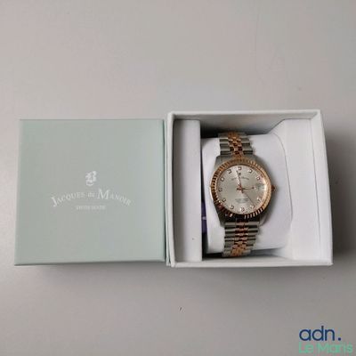 a box with a watch inside of it on a table