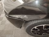 a close up of a car that has been dented