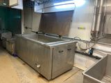 an image of a commercial kitchen with stainless steel appliances