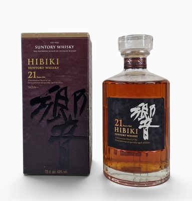 a bottle of hibiki 21 year old japanese whisky next to a box