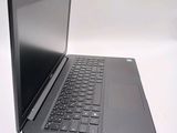 a laptop computer sitting on top of a white table