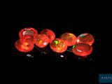 red fire oplite beads on a black background
