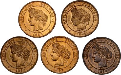four different types of gold coins on a white background