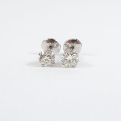 pair of diamond stud earrings on a white background