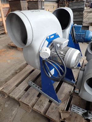 two blowers sitting on a pallet in a warehouse