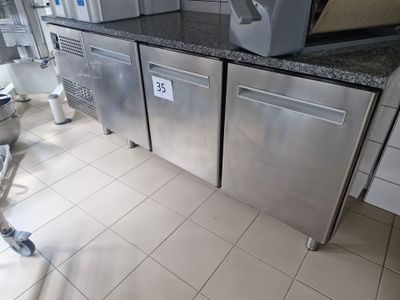 a picture of a commercial kitchen with stainless steel appliances