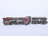 a toy train that is sitting on a white surface