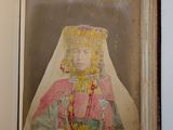 an old photo of a woman wearing a headdress and a veil