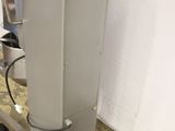 a machine that is sitting on a dolly in a room