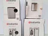 three boxes of brabantia coffee machines sitting on a table