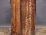 an old wooden cabinet sitting on top of a hard wood floor