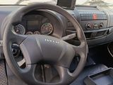 a dashboard of a truck with a steering wheel