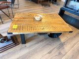 a wooden table with a bowl on top of it