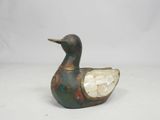 an image of a small metal duck figurine with a crystal in its beak