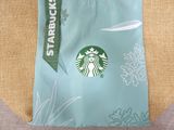 a starbucks bag with a starbucks logo on it
