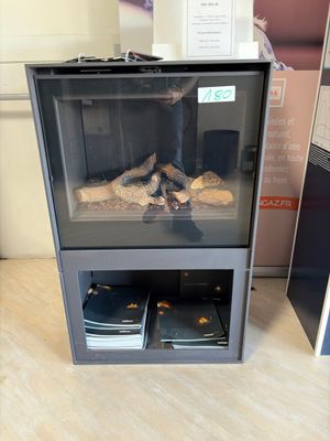 a glass display case with a bunch of food inside of it