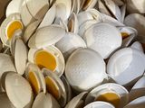 a box full of white and yellow plates and spoons