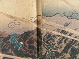 an old book with a picture of a man riding a horse