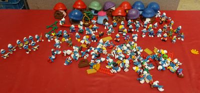 a red table with a bunch of legos on it