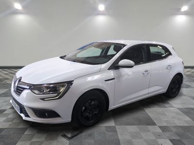 a white car is parked in a room with a checkered floor