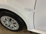 a white car with a sticker on the side of it