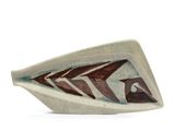 a white and brown bowl with a fish design on it