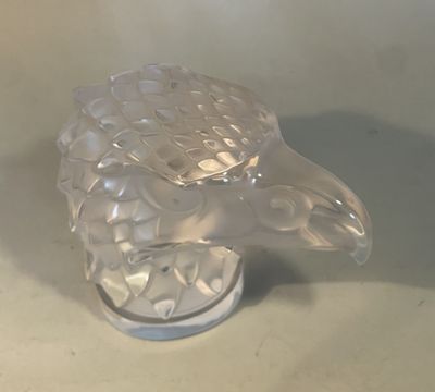 a glass sculpture of a turtle that is on a table