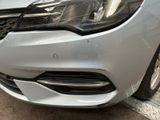 a close up of the front of a silver car
