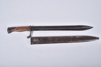 a knife and a knife holder on a white surface