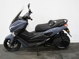 a picture of a motorcycle parked in a garage