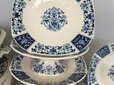 a lot of plates and bowls stacked on top of each other
