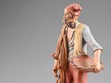 figurine of a man with a basket and a scarf