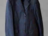 an image of a suit hanging on a hanger