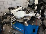 an image of a garage with a lot of tools on the floor