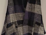 an image of a sweater hanging on a wall